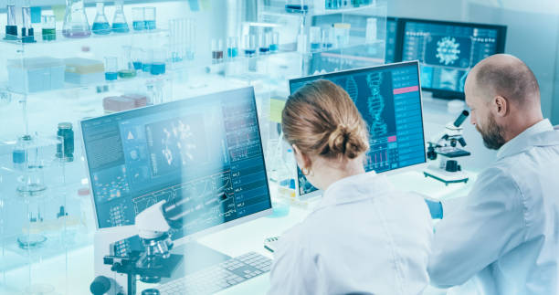 Microbiologist studying coronavirus with microscope. Fighting with pandemic